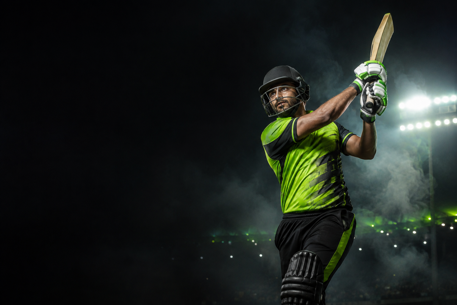 Cricket batsman in a lime green uniform playing under stadium lights